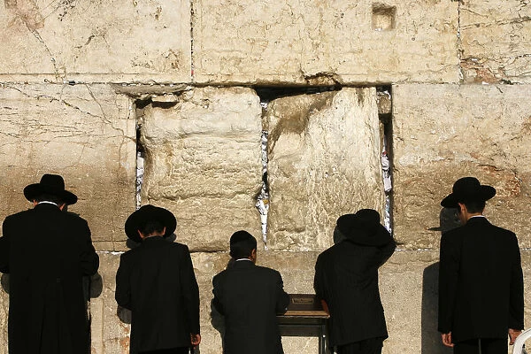 Ultra-orthodox Jewish men and boys pray at the Western Wall in the Old City of Jerusalem