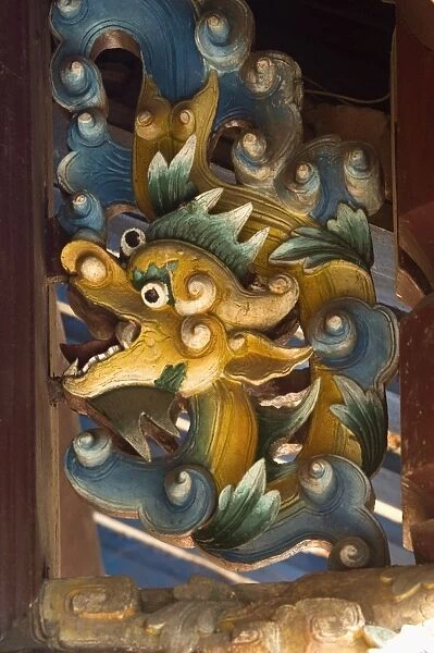 Vietnam, Quang Nam, Hoi An, carved wooden water dragon painted blue and yellow