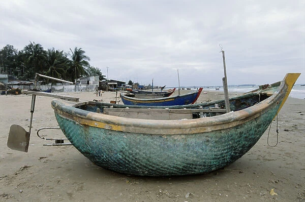Vietnam, Vung Tau, small circular woven bamboo fishing boats on beach