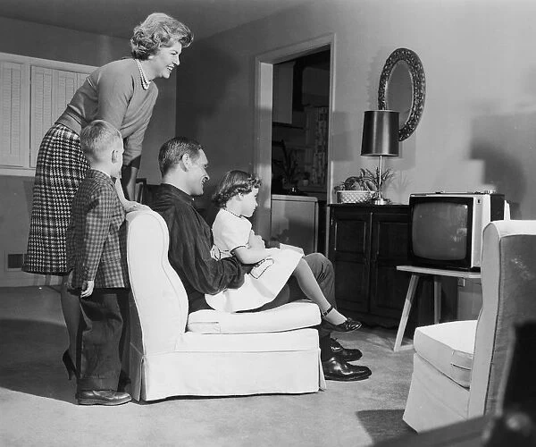 Vintage image of family watching television