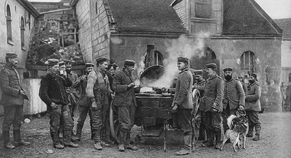 World War I 1914-1918: German soldiers round a mobile field kitchen in a French village