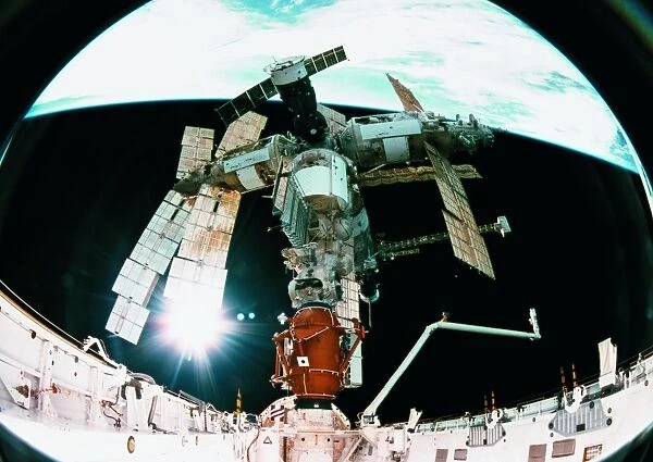 View from a wide angle lenses of a space station docking in orbit