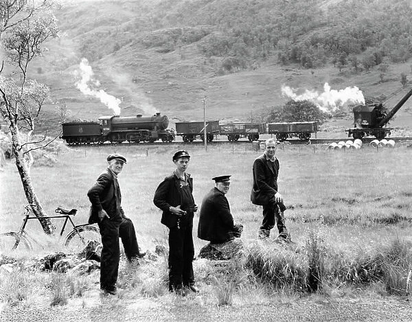 Four crew members enjoying a break, 1950