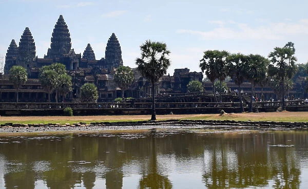 Angkor wat towers over pond - Siem Reap, Cambodia