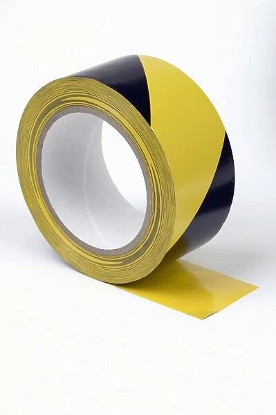 Black and yellow warning tape for underground conduit