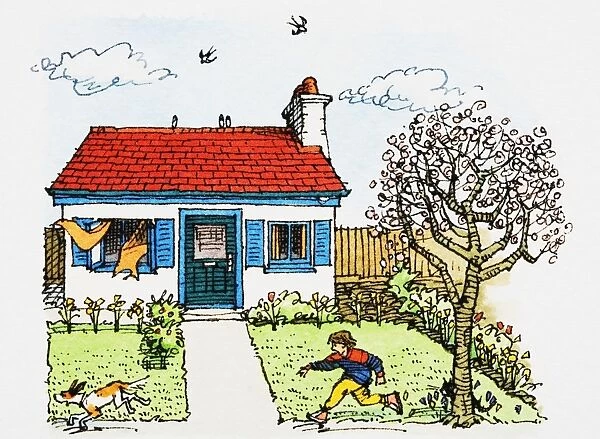 Boy chasing pet dog in garden of cottage-style house on chilly day