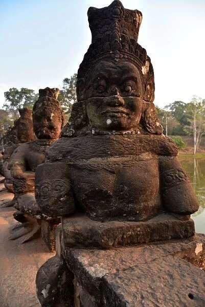 Demons statues alignment Angkor Siem Reap Cambodia