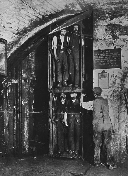 Going Up. circa 1900: Miners going up in the lift at the end of their shift