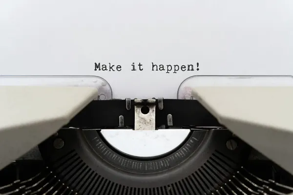 Make It Happen Text on Paper Inside Vintage Typewriter