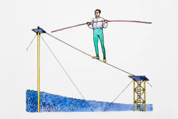 Man balancing on tightrope