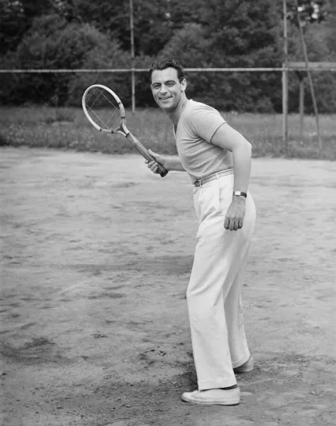 Man playing tennis, (B&W)