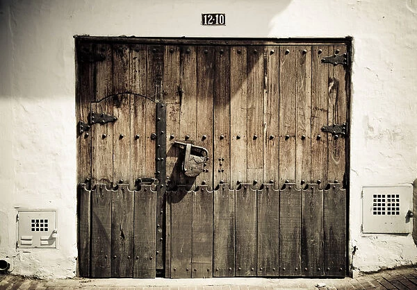 Old wooden door with a large padlock, Bogota, Colombia, South America