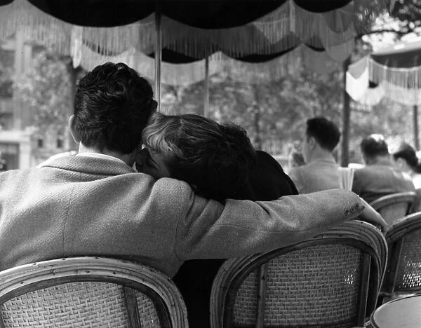 Parisian Lovers. 23rd June 1951: A young couple sharing an intimate moment