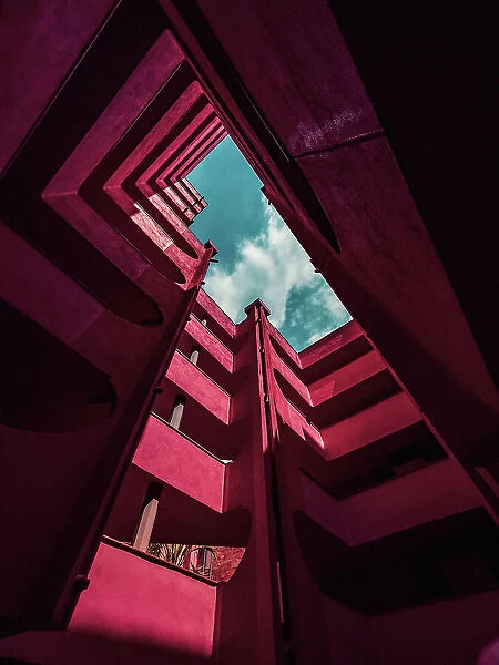 Red architecture with different levels and stunning design seen from below