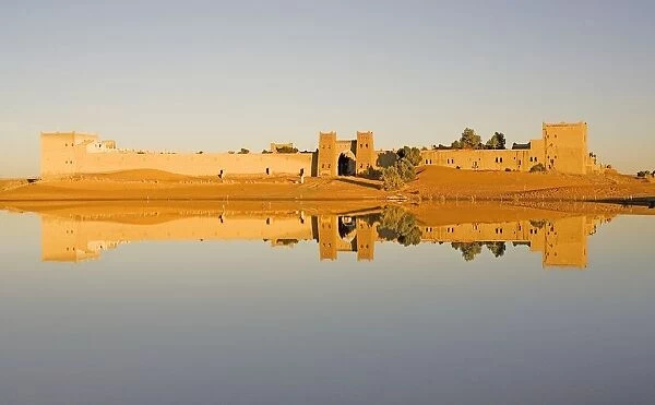 Reflection of Moroccan City Walls in a Dam