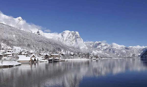 Reflection of snowcapped mountain in water, Backenstein Mountain, Ausseerland, Salzkammergut, Styria, Austria