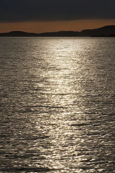 Reflections of the sun at dusk, Rodoyfjorden, Norway, Scandinavia, Europe