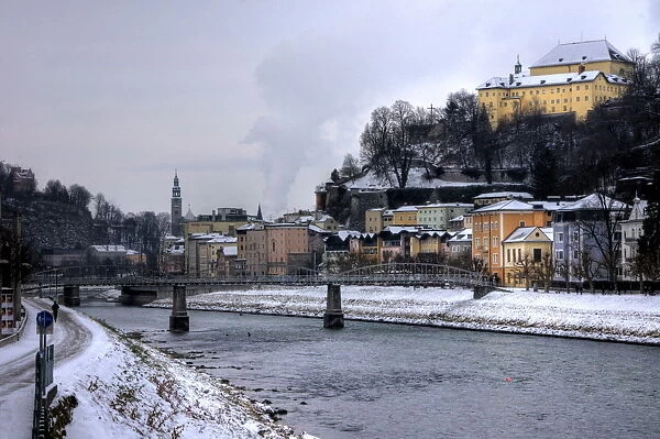 Salzach river in winter with Salzburg old town