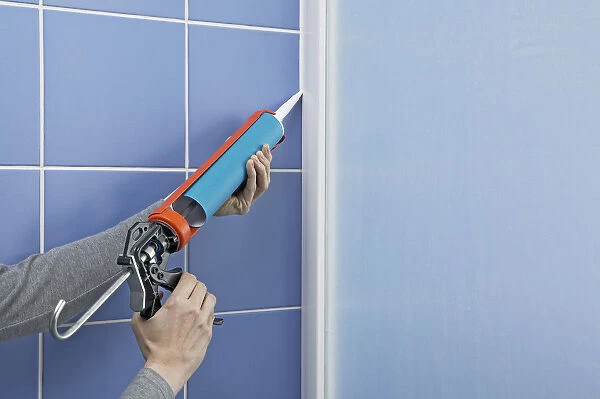 Using a sealant dispenser to seal outside edge of a shower screen