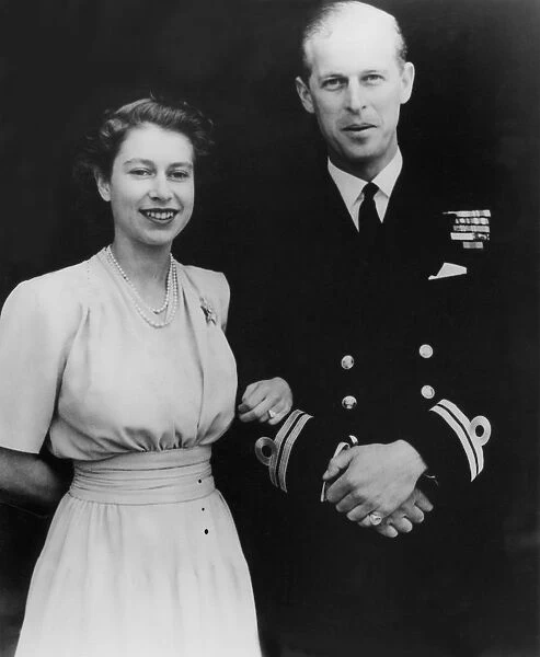 Looking radiantly happy, Princess Elizabeth, wearing her engagement ring, was photographed