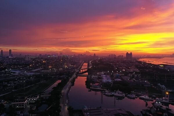 INDONESIA-LIFESTYLE. This aerial photo shows the sun setting over Jakarta on March 21