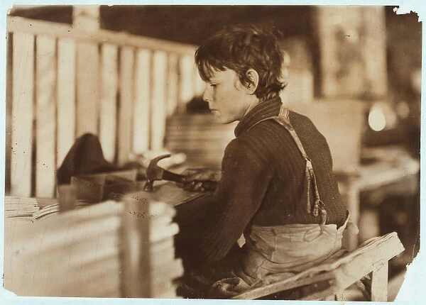Boy making baskets for melons at Evansville, Indiana, 1908 (b  /  w photo)