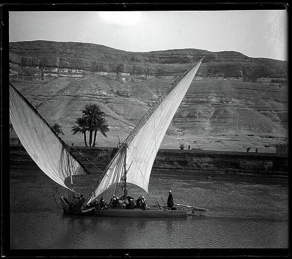 Egypt: Cook cruise on the Nile, a two-mats felouque crosses the tourist boat, 1900