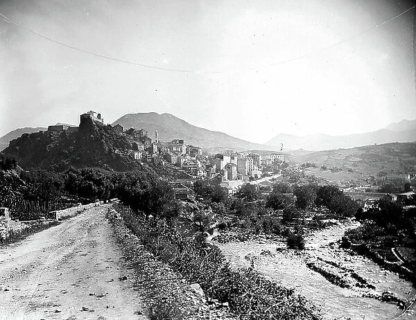 France, Corsica, Haute-Corsica (2B), Corte: overview with church, bell tower, citadel, stone houses and a dirt road, 1890