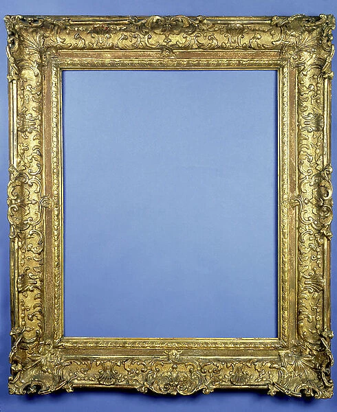 French Louis XIV carved and gilded frame with shell carved acanthus strapwork running to anthemion corner and centre cartouches, a gadrooned sight ornament