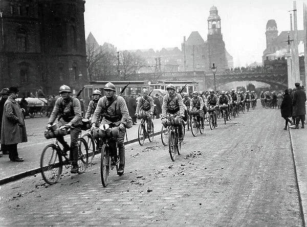 French soldiers riding bikes entering in Essen in january 1923, at the time of the occupation of the Rhur region (as consequences of-WW1 and Versailles treaty)
