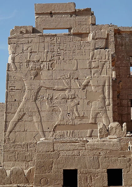 Horus and Knoum, holding prisoners by the bars, Horus temple, Edfu