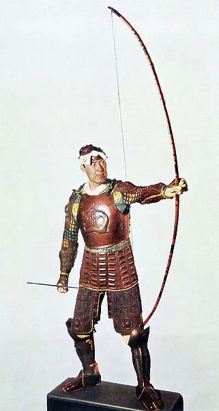 A Japanese Samurai Warrior in full armour holding a Bow