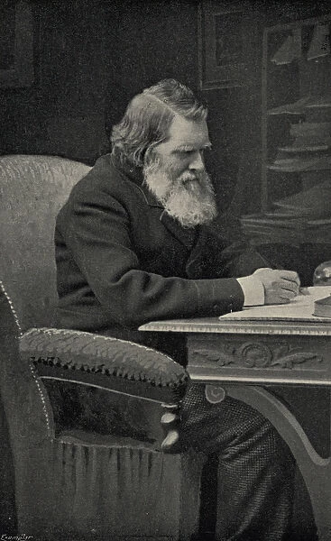 John Ruskin (1819-1900) in his study (litho)