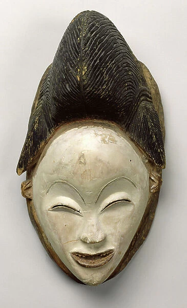 Mask of a deceased woman, Punu Population, from Gabon, 18th-20th century (painted wood)