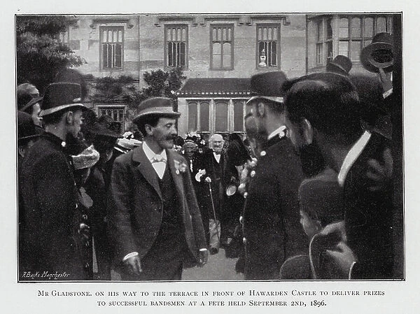 Mr Gladstone, on his way to the terrace in front of Hawarden Castle to deliver prizes to successful Bandsmen at a Fete held 2 September 1896 (b / w photo)