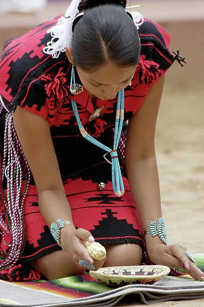 Navajo Blue Eagle Dancer performing the Corn-Grinding Dance at the Gallup Intertribal Ceremonials, New Mexico