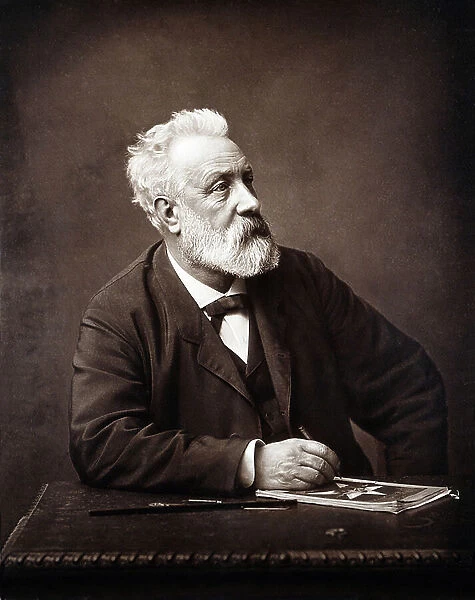 Portrait of the writer Jules Verne in Amiens, sitting at his desk writing in 1892