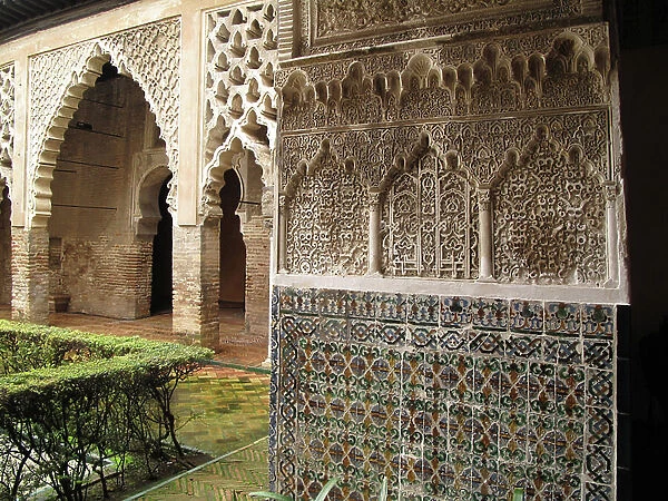 Detail of the sculpted and ceramic decoration of the fortified palace of the Alcazar of Seville (Spain)