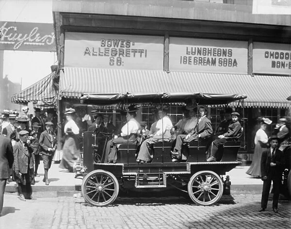 Seeing Chicago, auto at Monroe near State, Chicago, Illinois, 1900 (b  /  w photo)