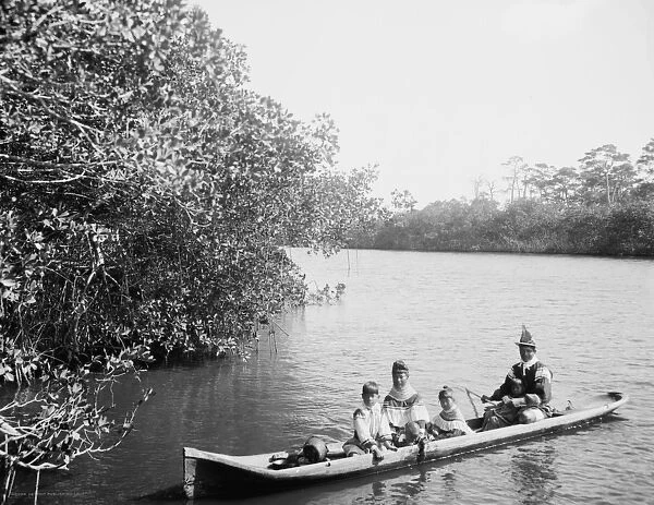Seminole Indian and family dugout canoe, Miami, Florida, c. 1910-20 (b  /  w photo)