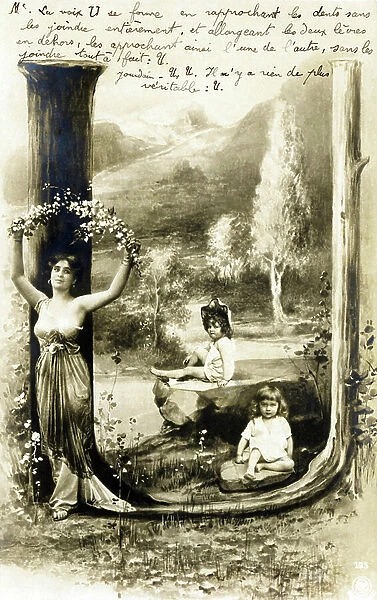 U: Letter U vegetale - Woman holding two flowered branches above her head, two girls sitting - Art Nouveau Alphabet - Fashion 1904, early 20th century (postcard)