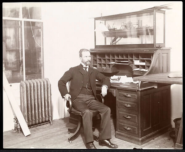 View of a man at a desk, presumably part of the Nicaragua Canal Commission, Nicaragua