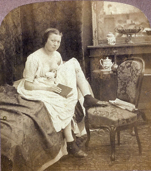 A young girl bed sitting on her bed, 1870