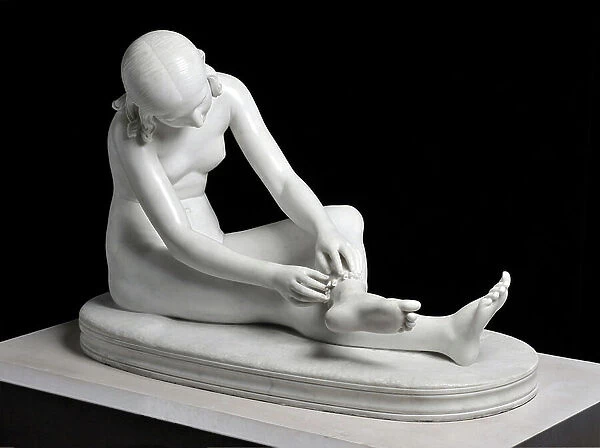 Young Indian sitting on the ground and adjusting to one of her legs a strip adorned with shells. Sculpture by Baron Francois Joseph Bosio (1769-1845). height: 70 cm Width: 106 cm. Depth: 50 cm. Exhibited at the salon of 1845. Musee Calvet, Avignon