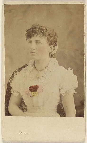 woman wearing flower embellished dress seated