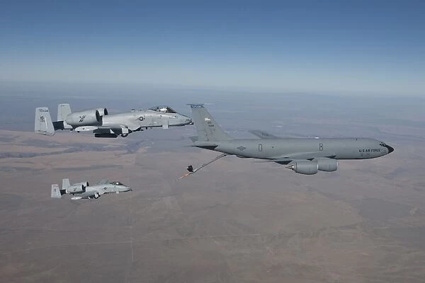 Two A-10C Thunderbolts prepare to refuel from a KC-135 Stratotanker