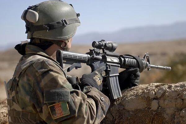 An Afghan Commando scans the horizon for enemy activity