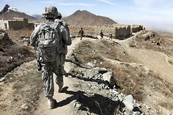 Afghan National Army and U. S. soldiers patrol the village of Akbar Kheyl, Afghanistan