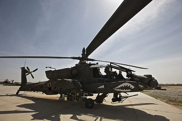 An AH-64D Apache helicopter parked at Camp Speicher, Iraq