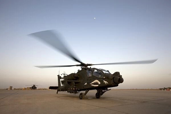 An AH-64D Apache Longbow Block III gets ready for takeoff